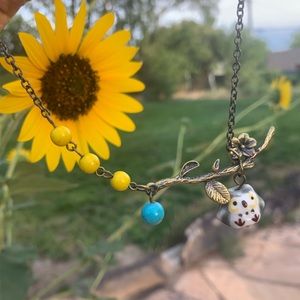 Porcelain Owl, Gun Metal Necklace w/beads.